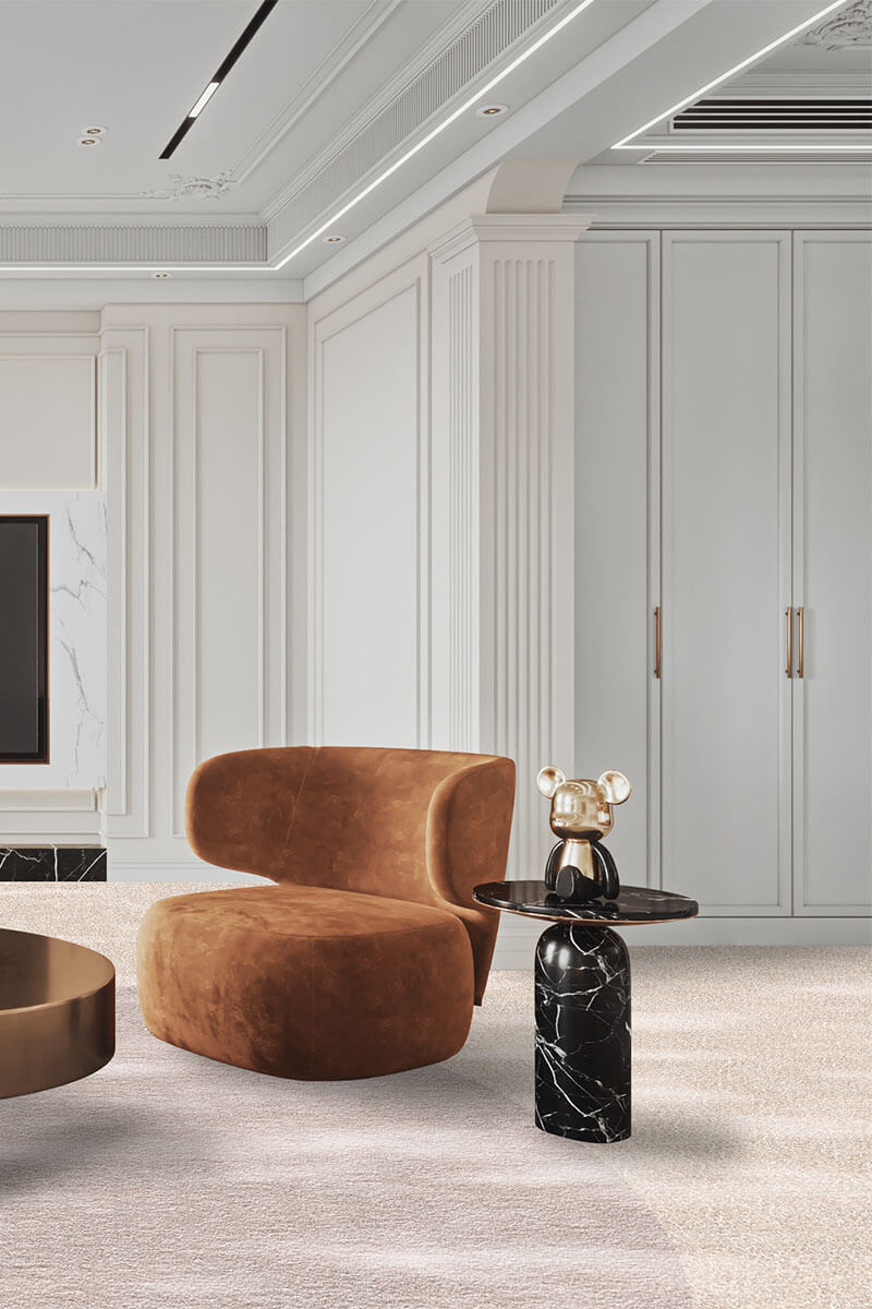 Modern interior with a brown armchair and marble side table.