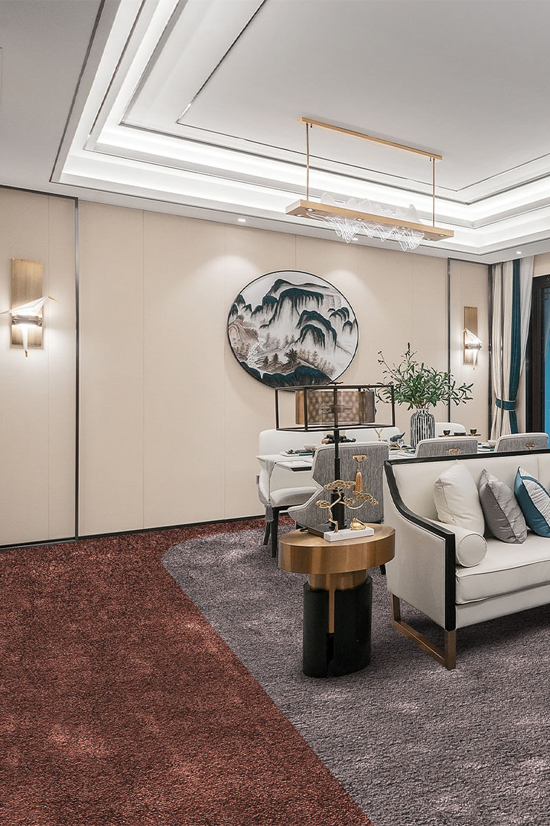 Modern living room with white sofa, round table, and decorative wall art.