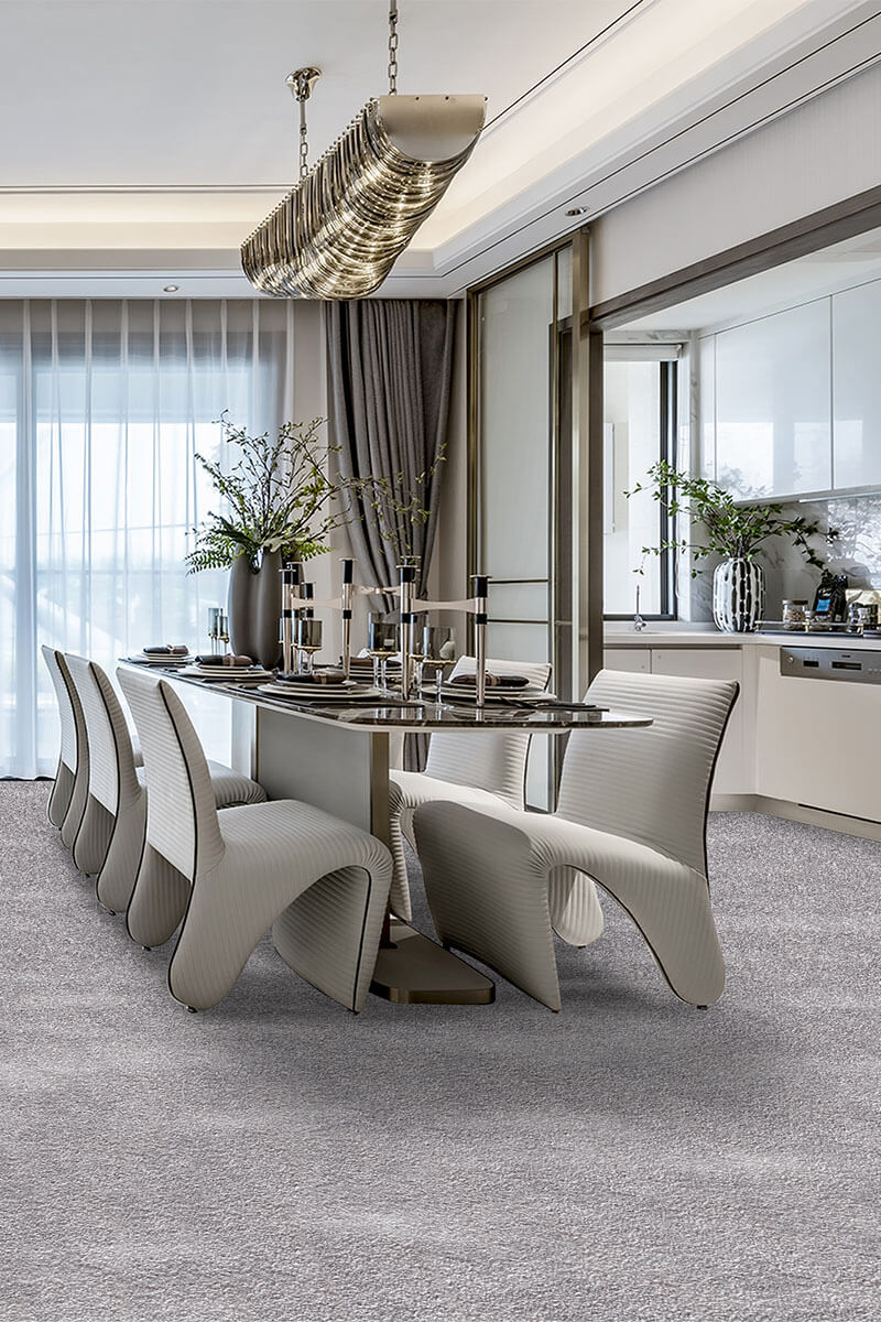 Modern dining room with a stylish table and chairs in a well-lit kitchen.